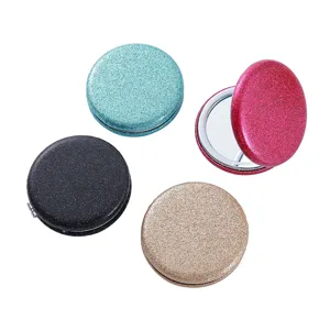 Close-up detail view of portable mini glitter pocket compact folding makeup mirror set.