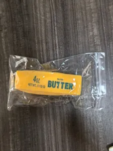 Slow rebound simulated butter squishy toy detail view, soft PU material, stress relief item.
