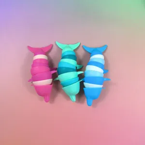 Close up detail of colorful articulated fidget dolphin toys with flexible moving body parts.