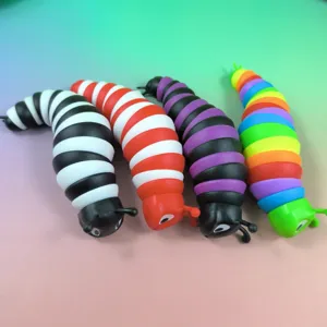 Close-up detail view of colorful articulated fidget slug toys, flexible twisting design.