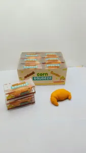 Detailed view of slow rebound croissant squeeze toy packaging box and single squishy item.