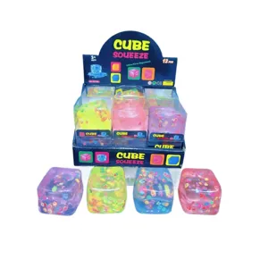 Cube anti-stress carre transparent avec tranches de fruits, jouet sensoriel souple.
