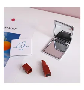 Portable double-sided folding makeup mirror with cute cartoon design for daily cosmetic use.
