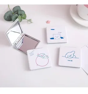 Detailed view of portable square folding makeup pocket mirror with cute cartoon animal prints.