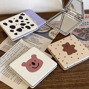 Portable folding makeup mirror with cute bear and cow pattern, leather compact pocket mirror.