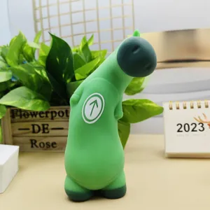 Detailed view of the funny green decompression toy showing its unique shape and chest arrow symbol.