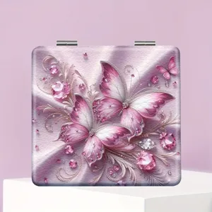 Quadratischer Klapp-Schminkspiegel mit eleganter rosa Schmetterling- und Kristall-Design.