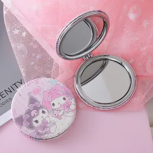 Portable folding pocket makeup mirror with cute cartoon prints, double-sided compact cosmetic tool.