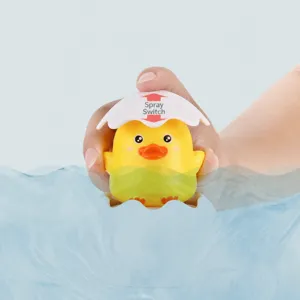 Baby bath duck water gun toy detail showing eggshell press mechanism and water spray function.