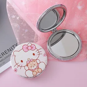 Detailed view of a cute cartoon folding double-sided pocket makeup mirror with metal frame.