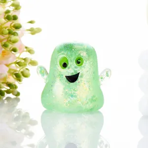 Detailed shot of a cute green glitter ghost squishy toy, featuring soft slow rebound design.