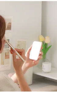 Portable foldable LED makeup mirror for dorm desk, compact pink travel vanity mirror.