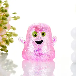 Cute pink glitter ghost squishy toy for Halloween decompression and stress relief play.