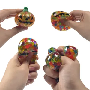 Halloween pumpkin squeeze toy with colorful beads for stress relief and fun entertainment.