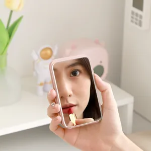 Portable folding makeup mirror for dorm and travel, compact pocket mirror with clear glass.