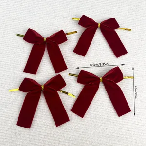 Red velvet Christmas bows with gold twist ties for gift wrapping, tree and wreath decoration.