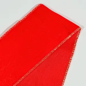 Red Christmas ribbon with gold wired edge for tree decor gift wrapping holiday party crafts.
