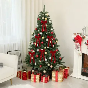 Christmas tree with red velvet bows and festive ornaments for home holiday party decor detail.
