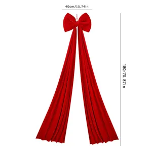 Large red velvet Christmas bow pendant with long tails for festive tree and holiday decor.