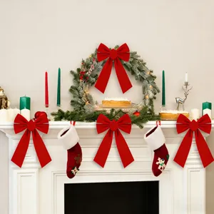 Close-up view of red Christmas double bow hanging ornament for cozy fireplace party decor.