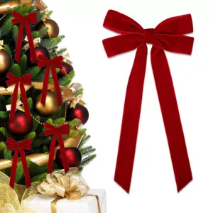 Large red velvet Christmas bow for tree decoration, holiday party door and home ornament.