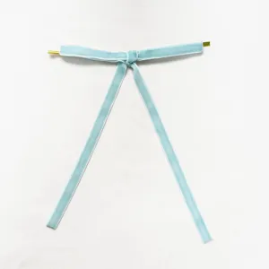 Light blue velvet ribbon pendant with gold metal ends for Christmas holiday decor.