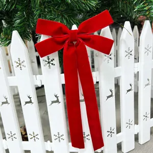 Large red velvet Christmas bow detail showing soft fabric texture and festive holiday charm.