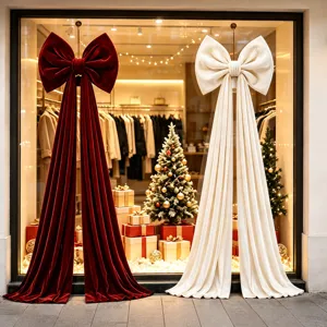 Large velvet Christmas bow hanging decor for holiday window display and tree ornament.