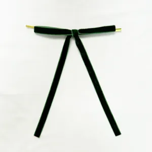 Dark green velvet bow detail hanging ornament for Christmas tree decor and holiday display.