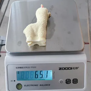 Alpaca squishy toy weight detail view showing soft squeeze stress relief design.