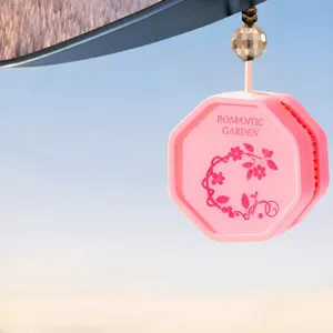Pink hexagonal hanging air freshener for car and wardrobe, long-lasting aroma tablet.