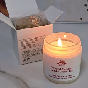 Hand-poured soy scented candle in glass jar with warm glow, ideal for home decor details.
