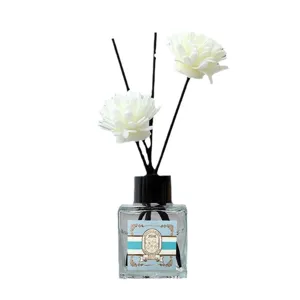 Reed diffuser indoor fragrance glass bottle with floral sticks for home air freshener.