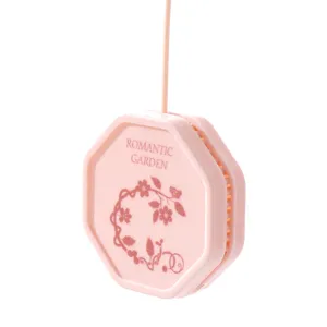 Pink octagonal hanging air freshener sachet with floral design for wardrobe and car.