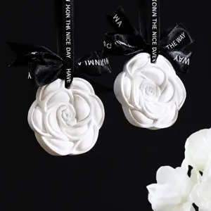 White camellia plaster fragrance hanging diffuser with black ribbon for wardrobe car decor