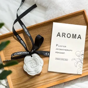 White camellia plaster aroma pendant for wardrobe and car, long-lasting fragrance decor.