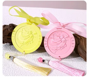 Detailed shot of Chinese style scented gypsum hanging tablet with ribbon and tassel decor.