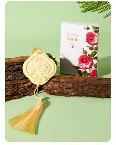 Exquisite carved rose aroma stone pendant with tassel, perfect for car and home decor detail view.