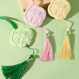 Aromatherapy gypsum hanging stone car pendant with rose relief and elegant tassel decor.