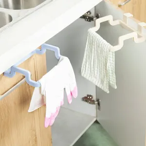 Kitchen cabinet door hanging rack for trash bags and towels, convenient plastic holder.
