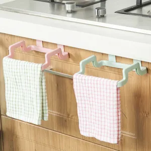 Kitchen cabinet door hanging trash rack detail, plastic bag holder and rag storage bracket use.