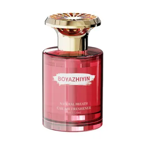 Luxury car air freshener perfume bottle diffuser with gold cap and red bottle for fresh scent.