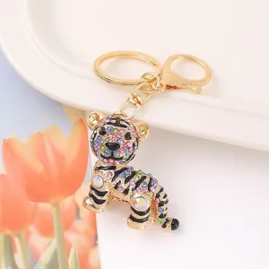 Colorful rhinestone tiger keychain close-up, glittering crystal metal pendant detail.