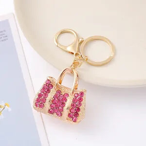 Porte-clés sac à main en strass tendance, alliage plaqué or, pendentif sac brillant élégant.