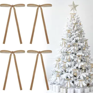 Detailed view of velvet Christmas bow hanging ornament with long tails for tree and decor.