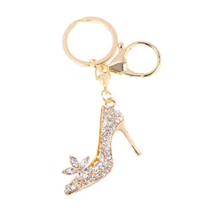 Goldener Strass-Stöckelschuh Schlüsselanhänger mit Kristallblume, elegante Metalltasche.