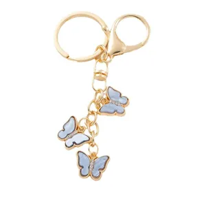 Gold-tone butterfly keychain with cute blue acrylic charm and sparkling rhinestones for bags.