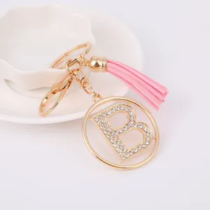 Metal rhinestone letter B pink tassel keychain bag charm detail view, fashion gift wholesale.