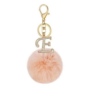 Pink fluffy faux rabbit fur pom pom keychain with rhinestone letter E charm. Gold metal clasp.