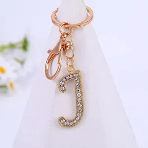 Gold rhinestone letter J keychain, alloy initial keyring pendant accessory for bag or keys detail view.